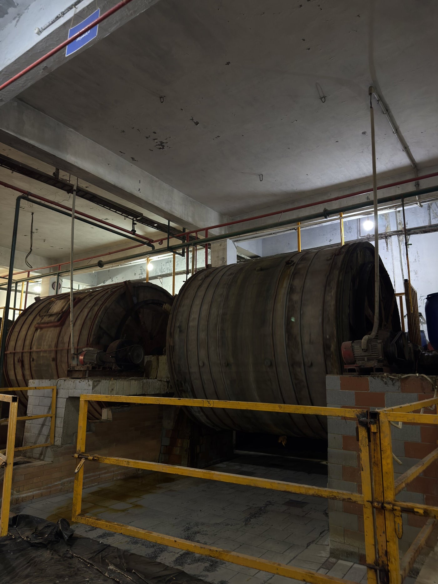 Wooden tanning drums at a tannery in Pakistan